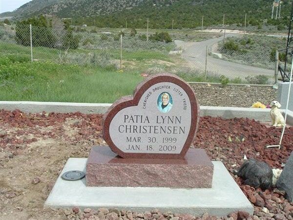 Rose granite heart shaped memorial with a porcelain portrait
