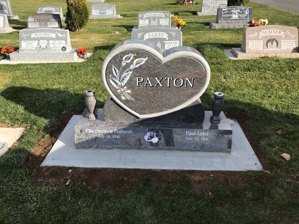 Rose granite heart shaped monument with carved calla lilies